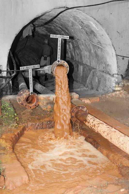 'Gas Pani' or wastewater containing acid mine drainage from an underground coalmine in Tipong Colliery of Makum Coalfield being released directly into Tipong river in Tinsukhia district, Assam